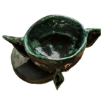 Green ceramic espresso cup with a handle on a white background
